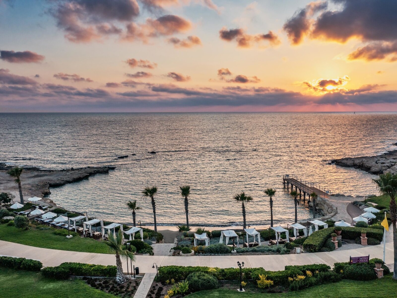 Two seagulls walking on the sand of a beach