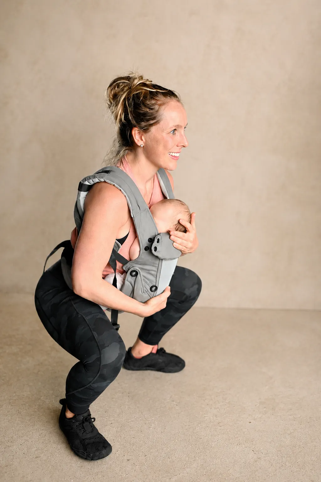 Madeleine Gray conducting a babywearing-friendly holistic personal training session