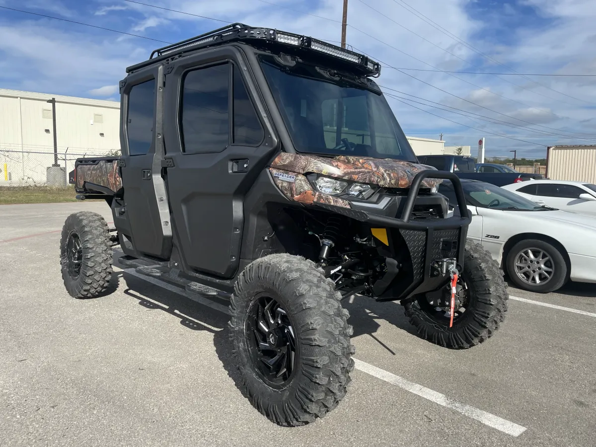 Can-Am Defender utility vehicle featuring professionally installed window tinting by Apache Armor. Our window tint services provide enhanced privacy, UV protection, and a sleek appearance for your vehicle.