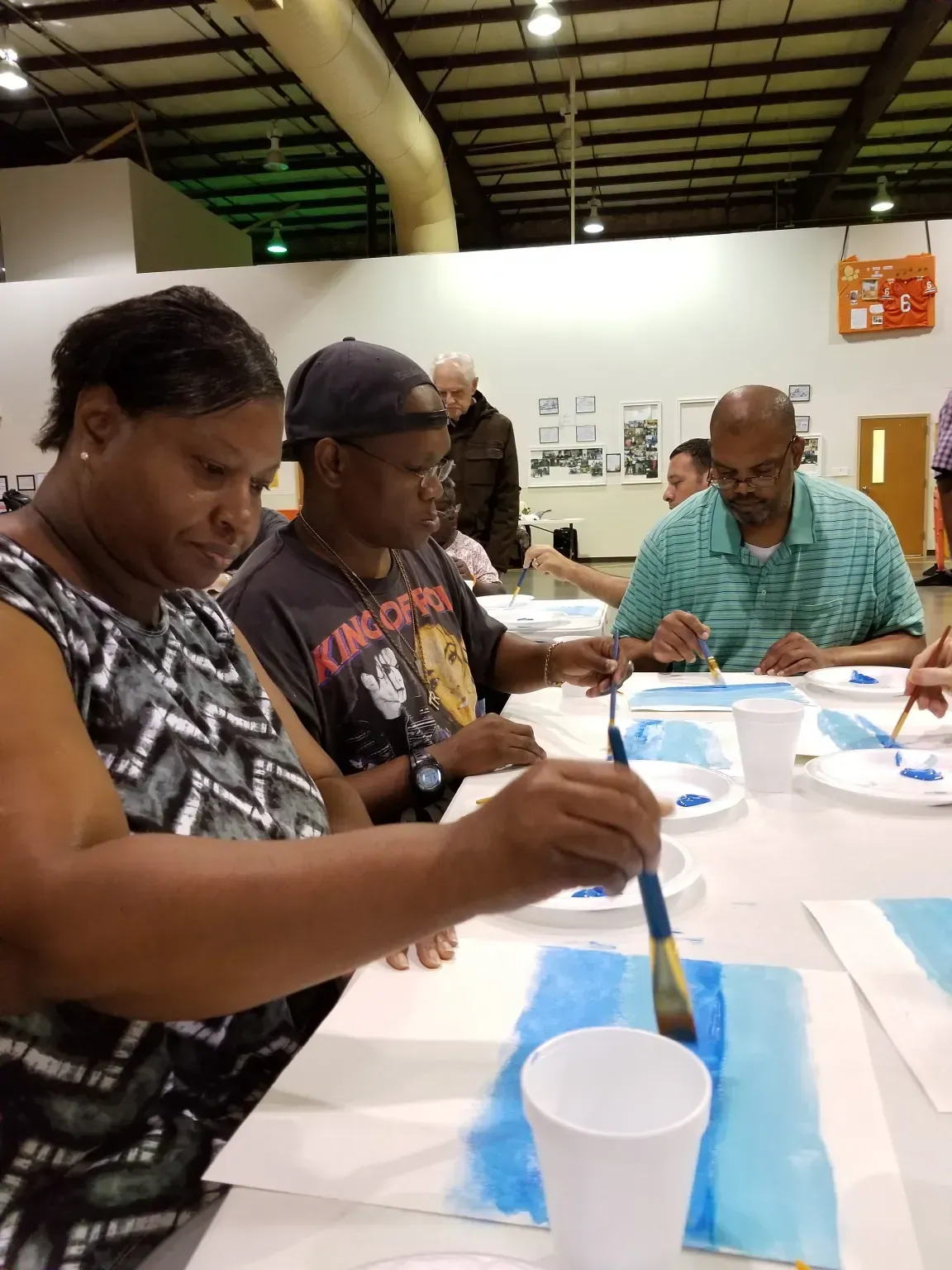 Participants Painting with blue water colors