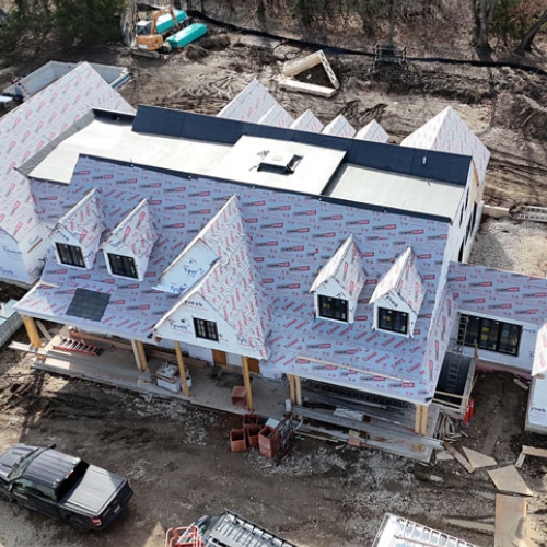 Roof under construction on a new farmhouse build, for modern farmhouse builder in olathe kansas