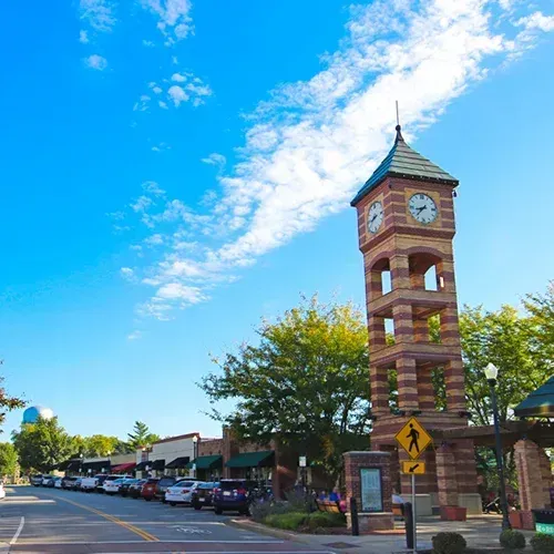 Luxury custom home community near downtown Olathe Kansas featuring upscale residential neighborhoods like Stonebridge Estates and Boulder Creek with high-end construction, custom architectural details, and proximity to Blue Valley and Olathe school districts
