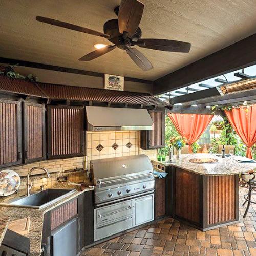 A newly built outoodr covered kitchen with rill and sink, for deck and outdoor living olathe ks