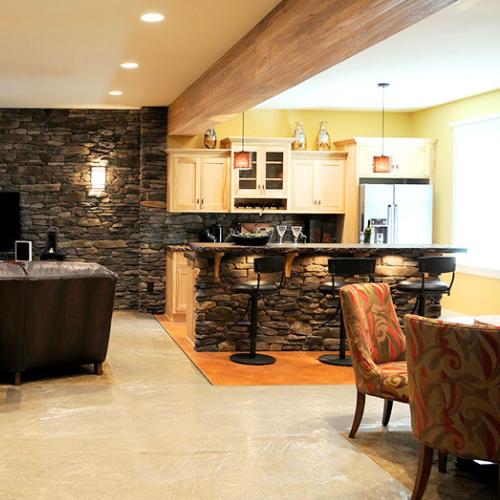 basement refinished with sofa and bar, for basement finishing contractor olathe ks