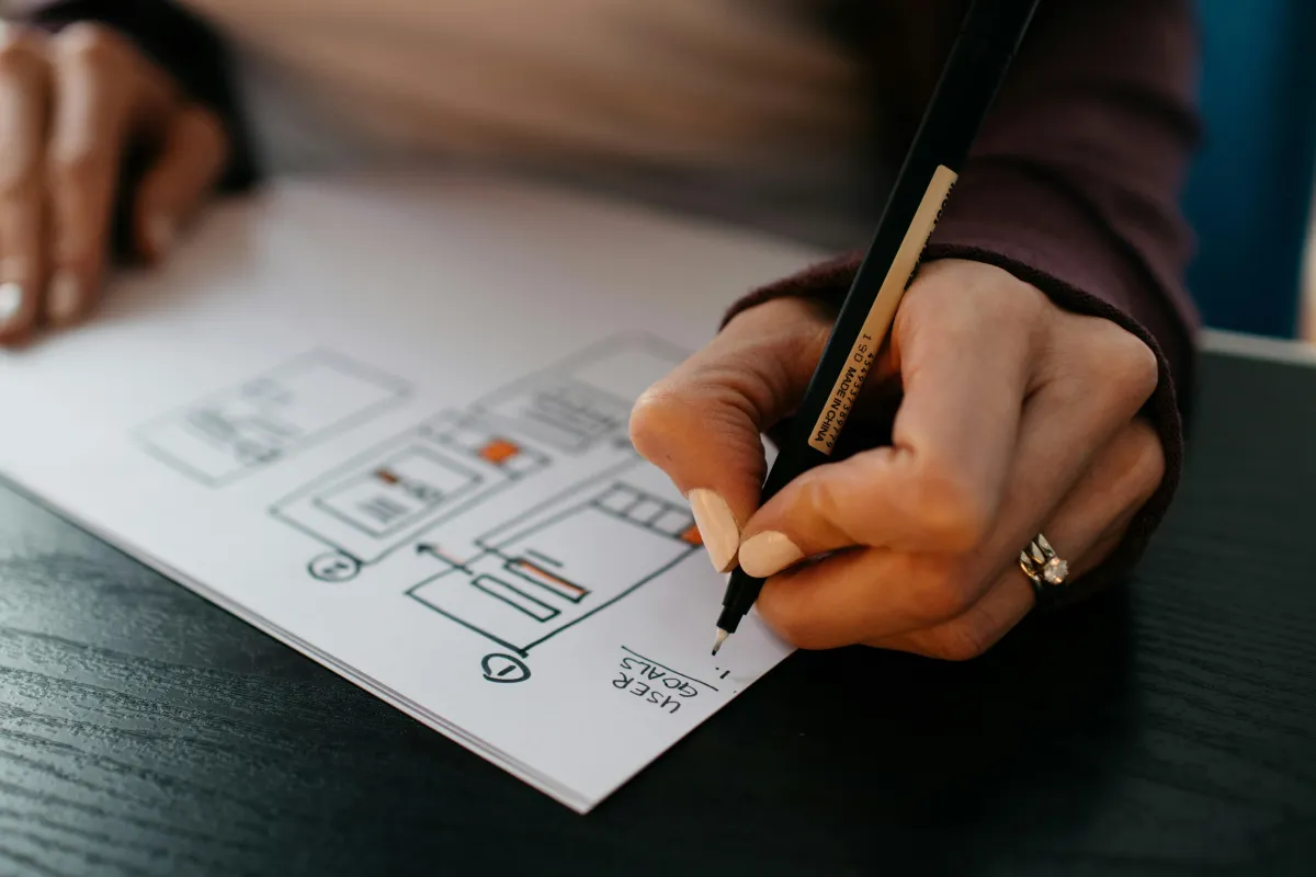 Home renovation planning session with architectural design drawings.
