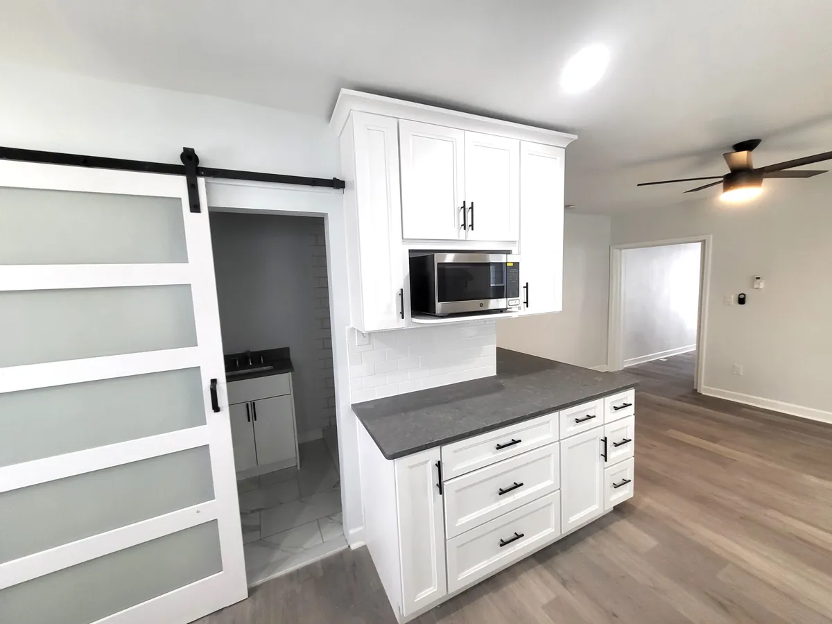 White kitchen cabinets with quartz countertops