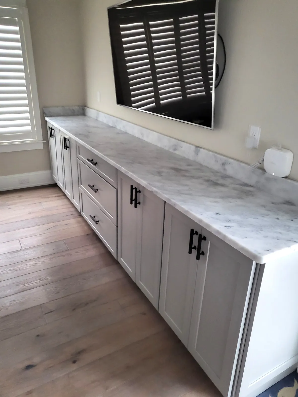 White kitchen cabinets with white quartz countertop