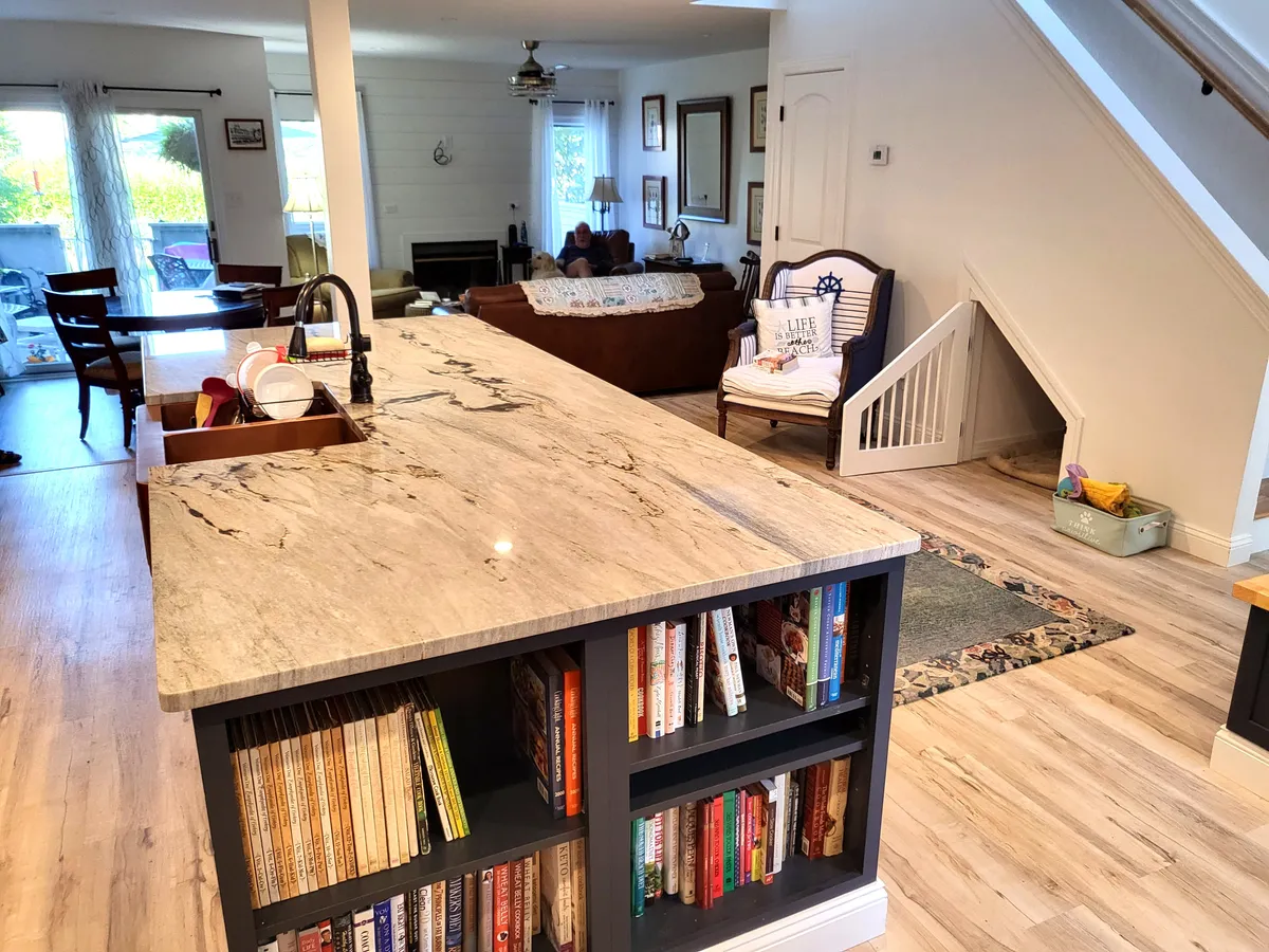 Quartz island in kitchen with shelves