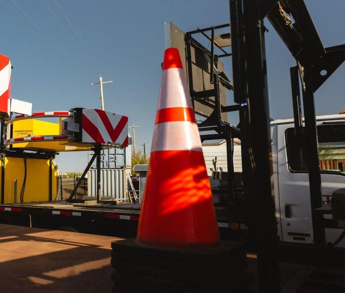 Bright safety cones set at ATEX Rentals equipment yard