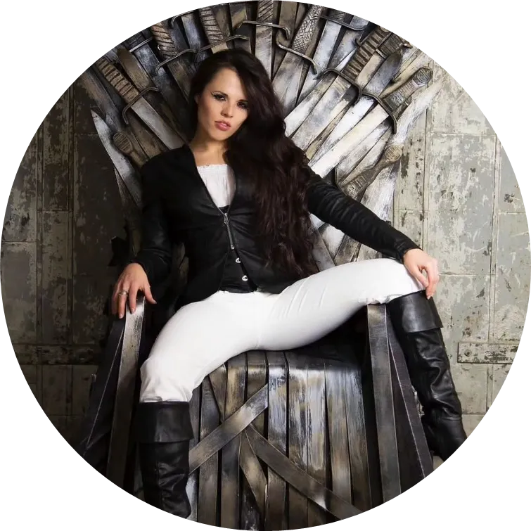 Raiza sitting on the Iron Throne