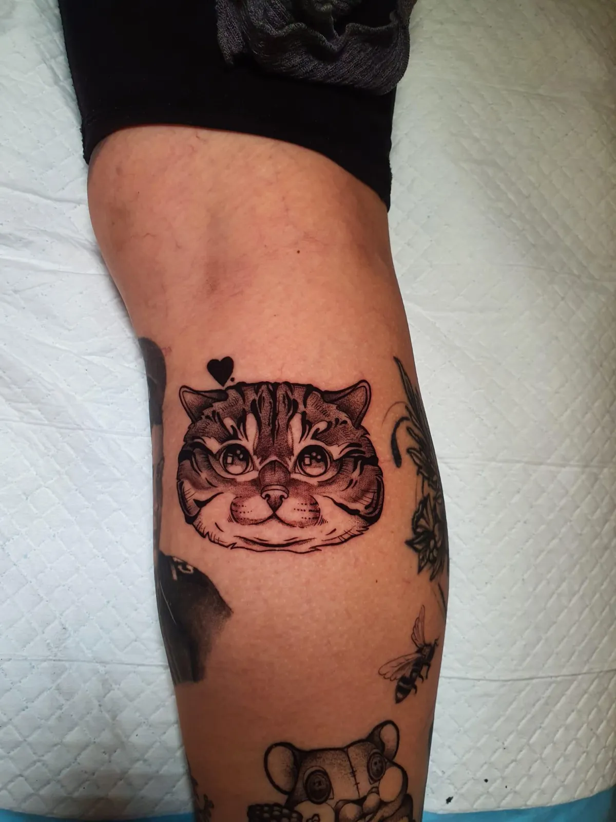 person in blue denim shorts and white nike sneakers standing on gray concrete floor