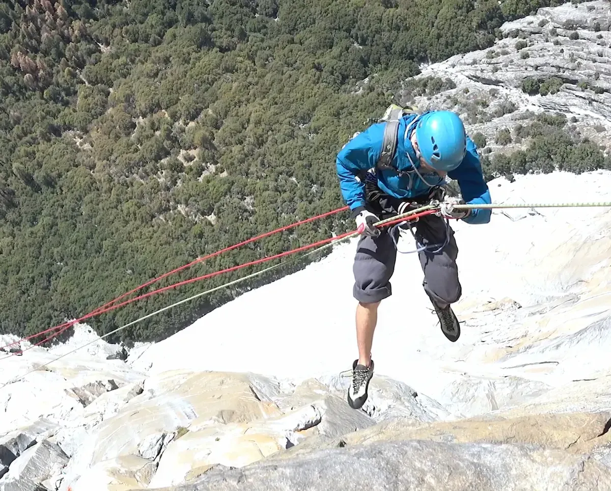 skiers climbing a couloir