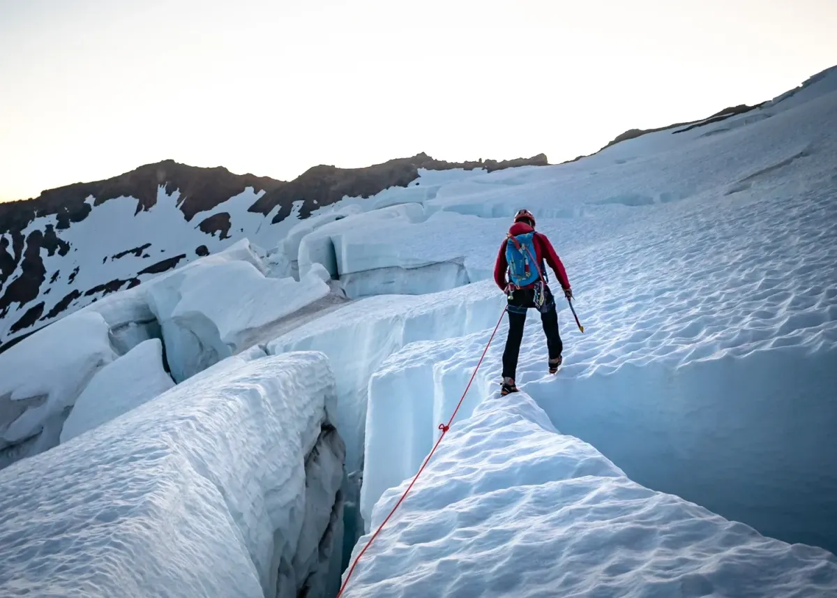 skiers climbing a couloir