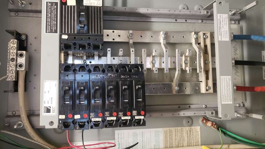 Steel cables and beams against a blue sky