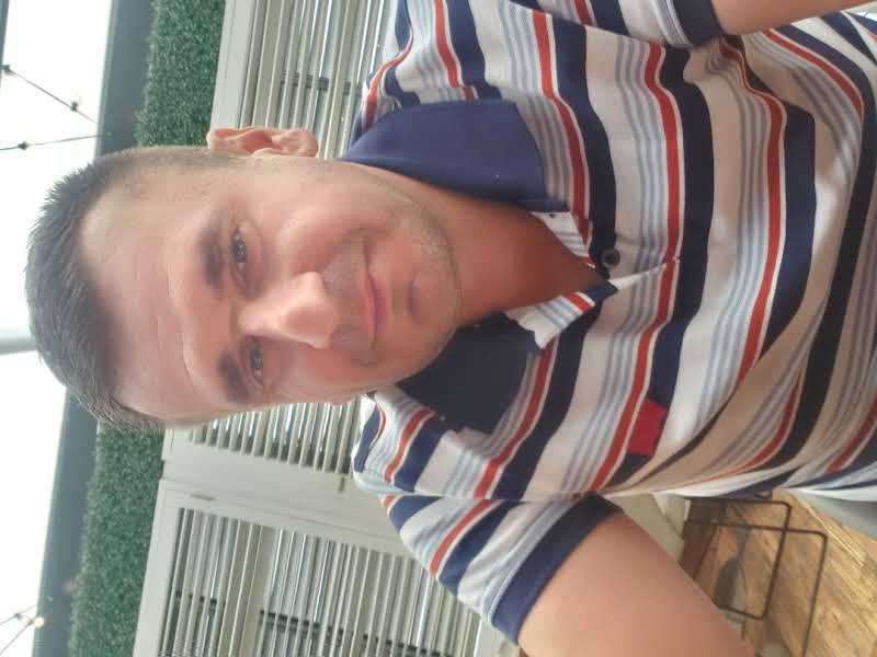 looking up at the top of two tall poles