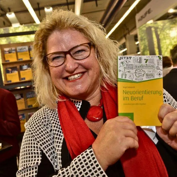 Birgit Gosejacob resenting her book "neuorientierung im Beruf", at the pulisher's booth, Haufe, a Frankfurt book fair