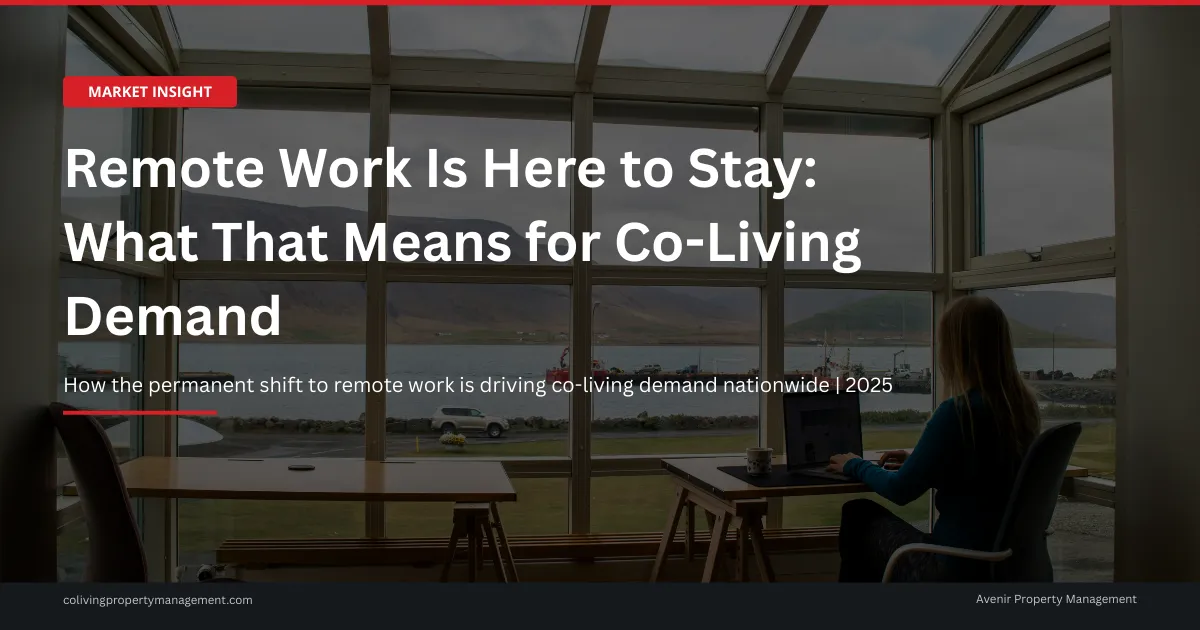 Young professional working remotely on laptop in a modern furnished co-living common area