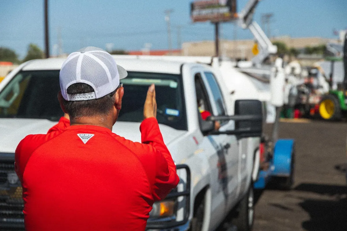 ATEX Services team member directing construction vehicles for architectural design and project delivery services in Texas and ColoradoS