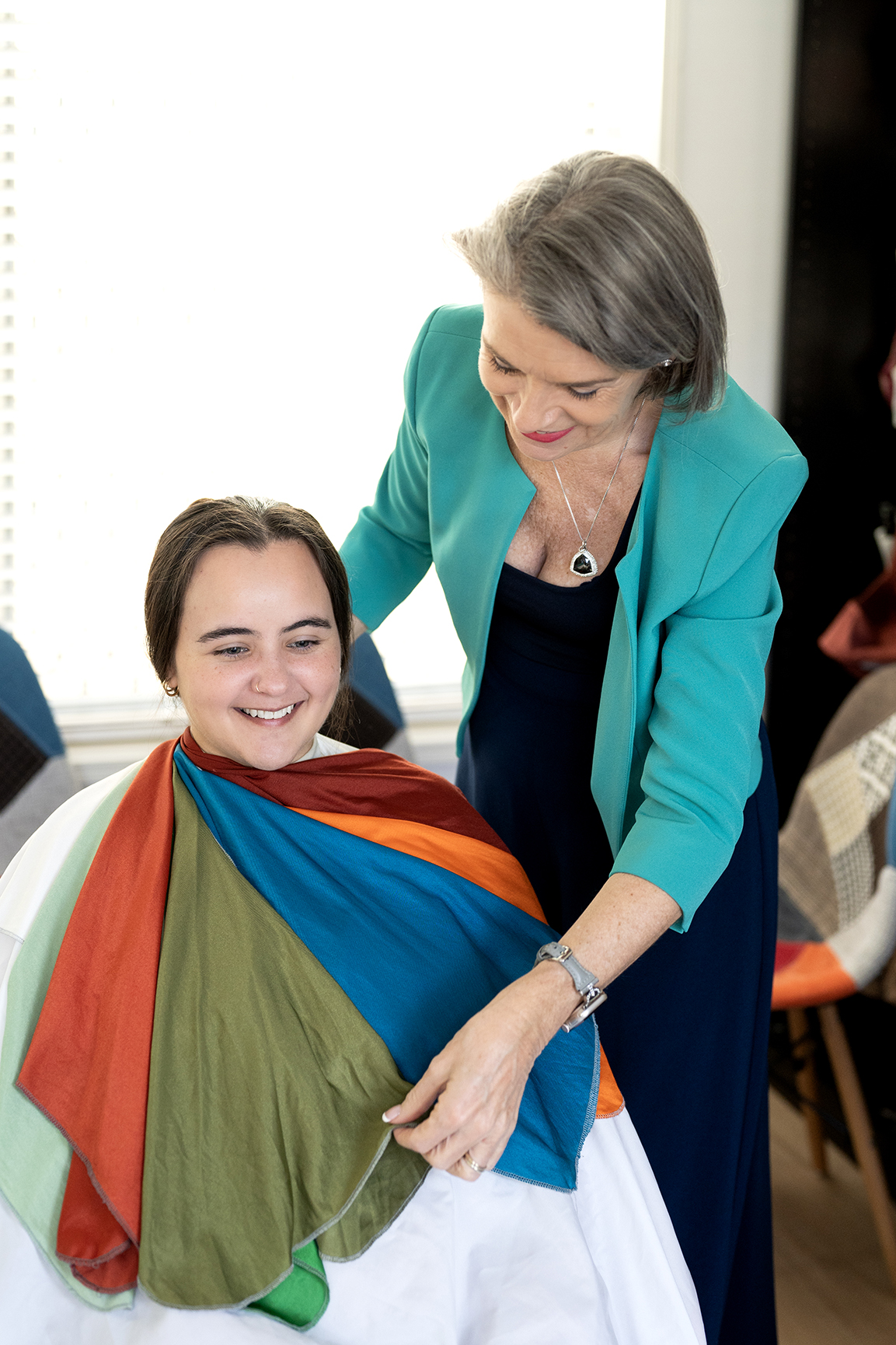 Young woman sitting on a wooden bridge