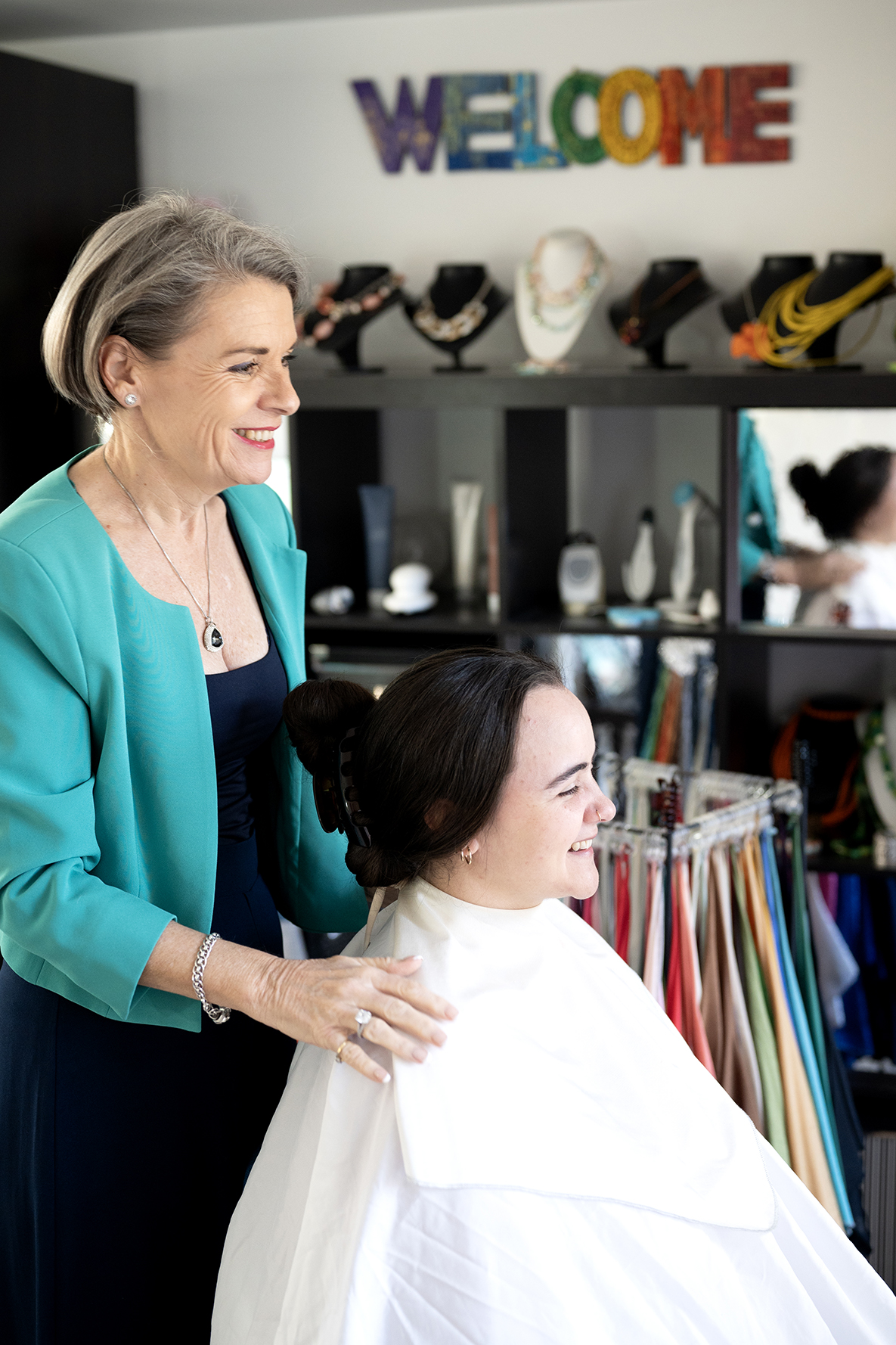 Ann guiding a female client through personal color analysis in her Brisbane Studio