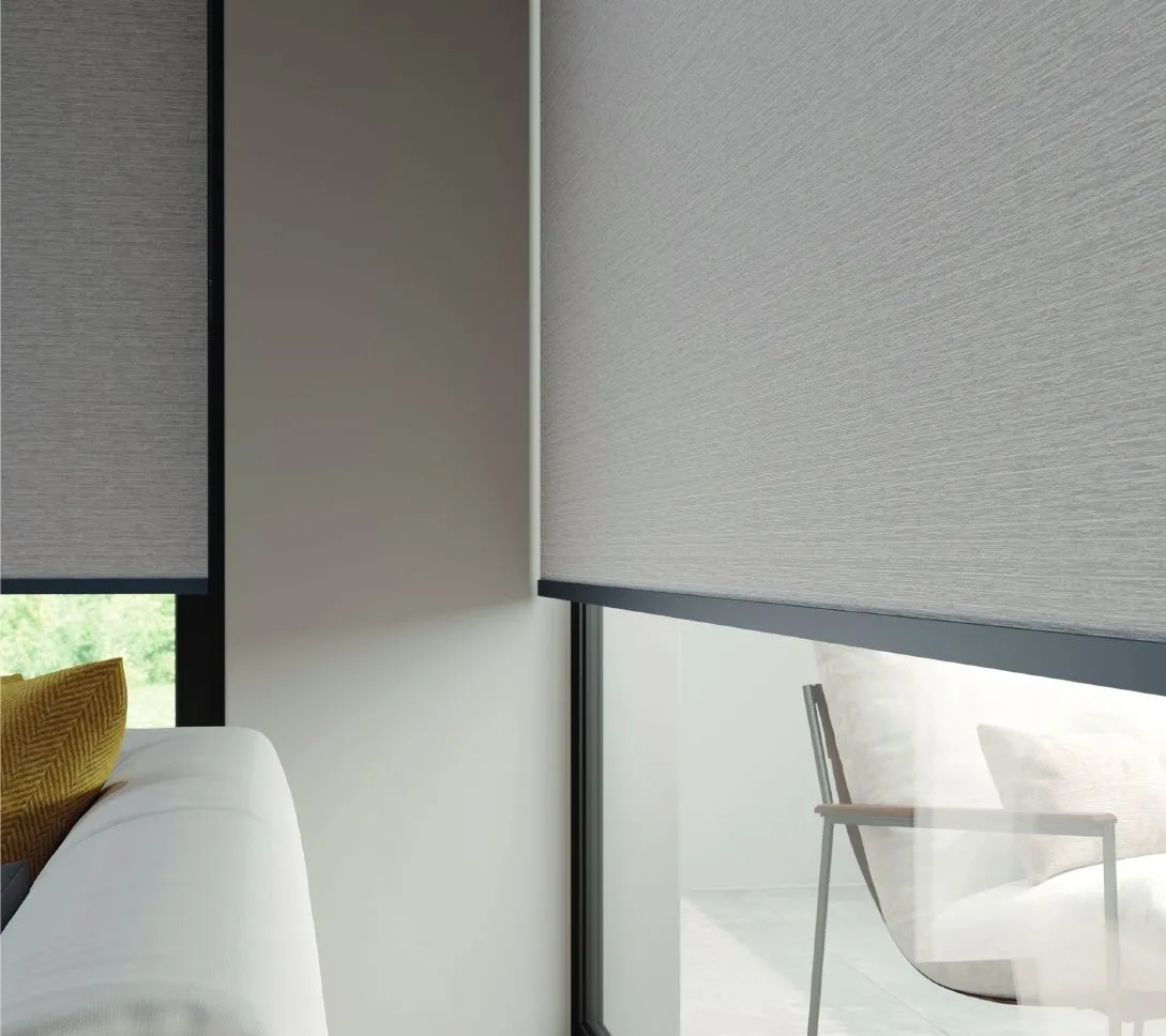 Grey made to measure roller blinds in a bright living room, Eclipse SBC serving Lincoln