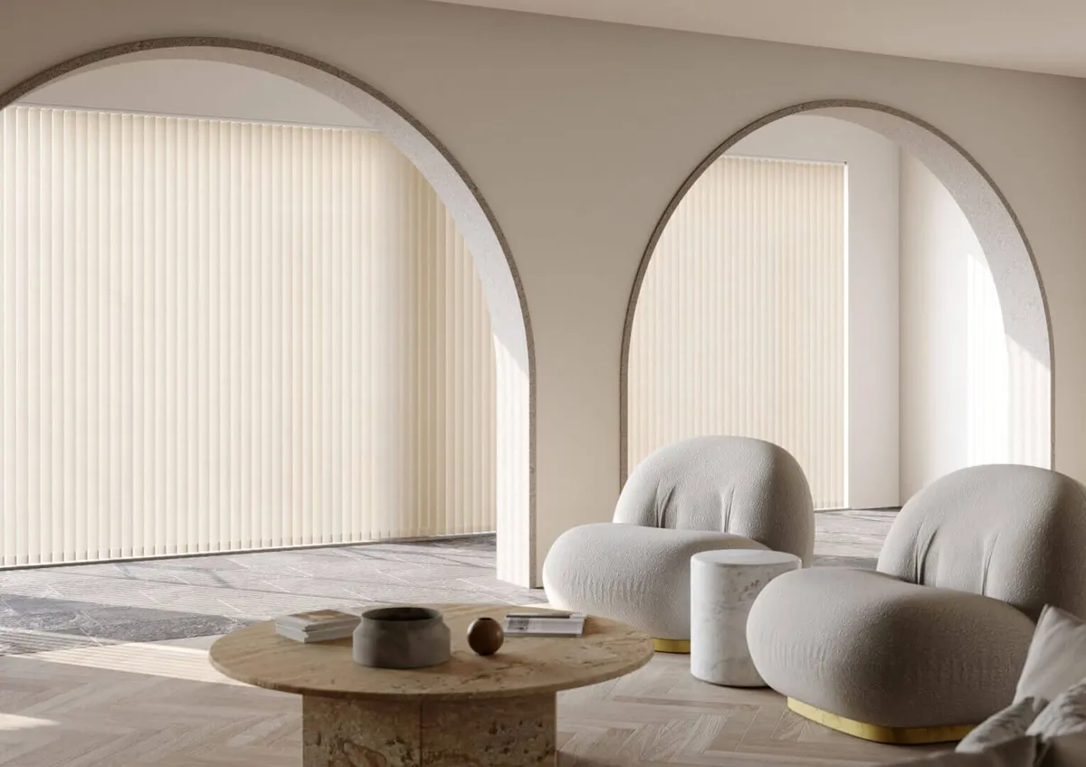 Cream made to measure vertical blinds on tall arched windows in a living room, Eclipse SBC serving Newark