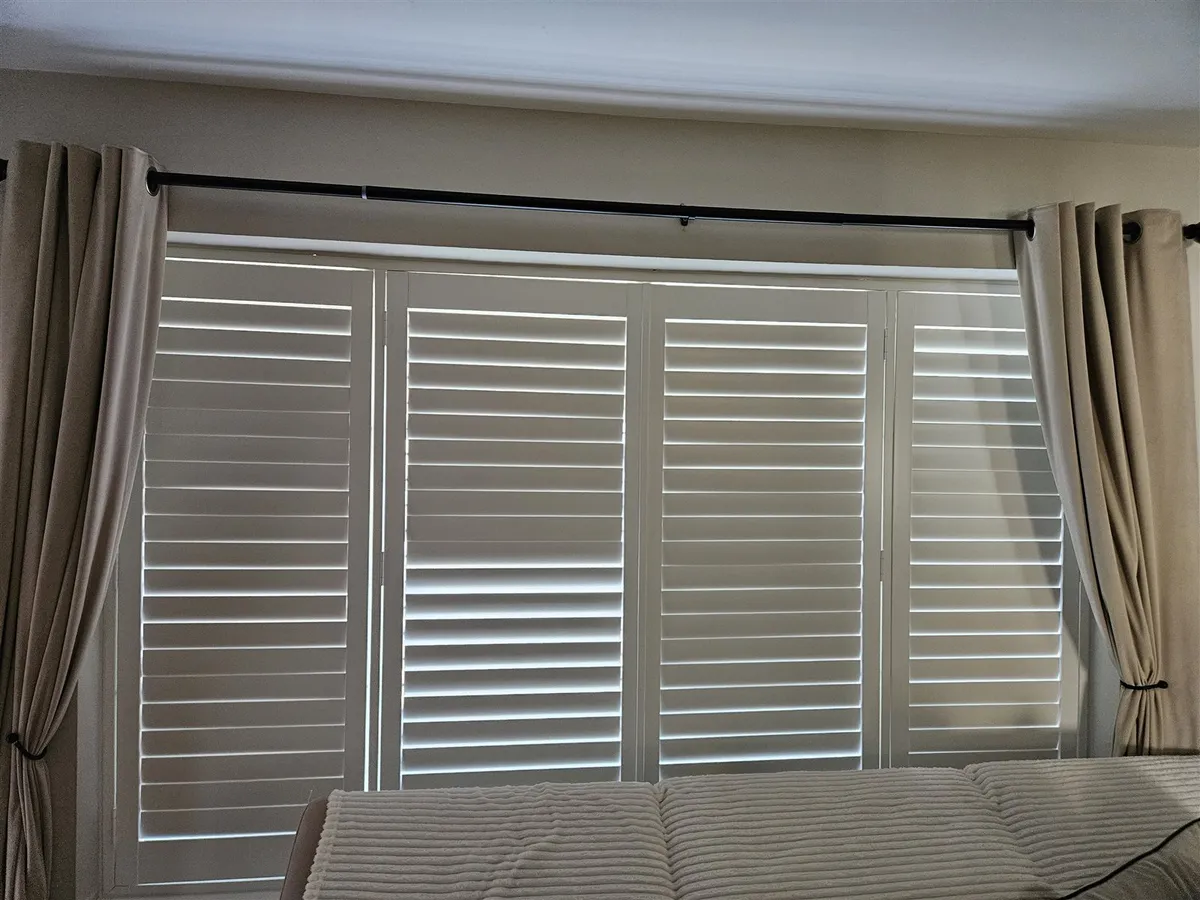 Hampton Polyvinyl Plantation Shutters in a Bathroom and Bedroom in Retford