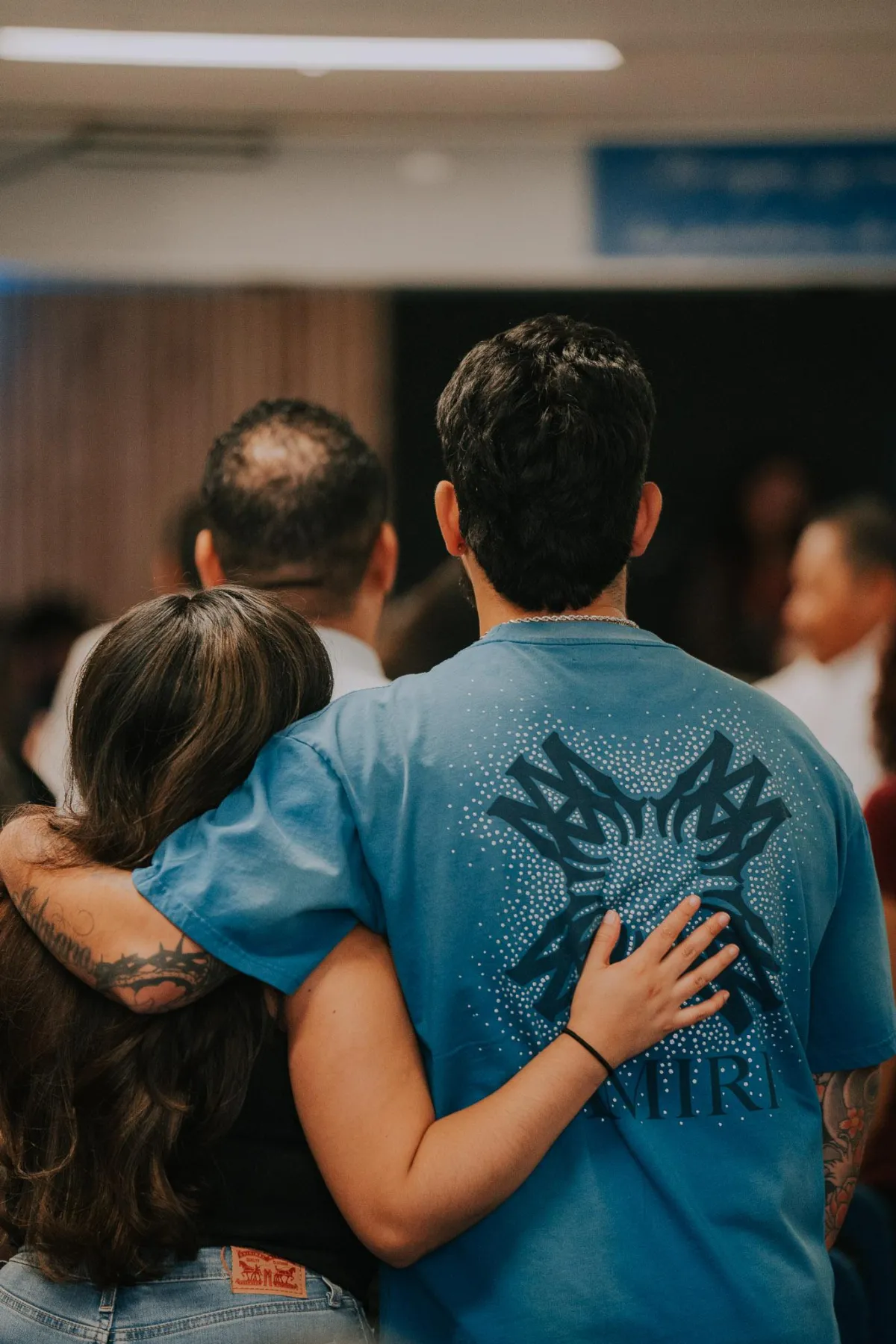 Couple hugging in worship