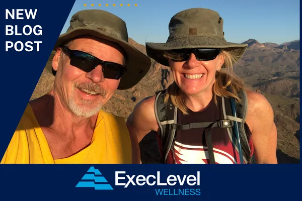 Two people in athletic wear hiking outdoors, representing strength and healthy aging after 50