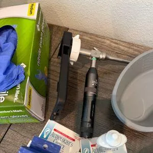 otoscope and gloves