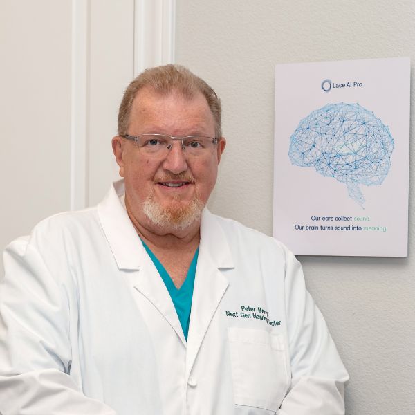 peter berry standing next to a lace ai sign