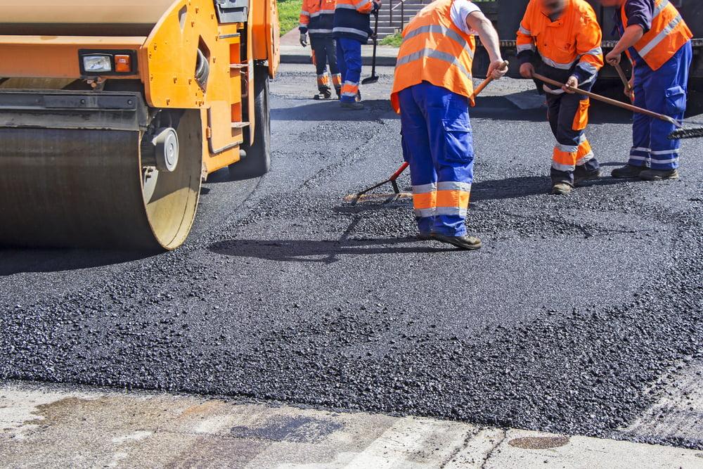 Cracked asphalt road being repaired by White Pine Asphalt & Paving team in White Pine, TN