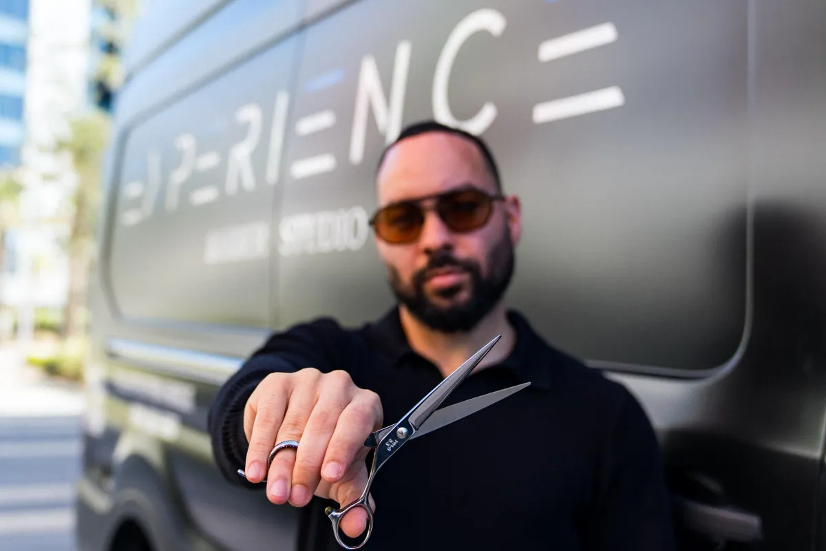 person holding handheld blade