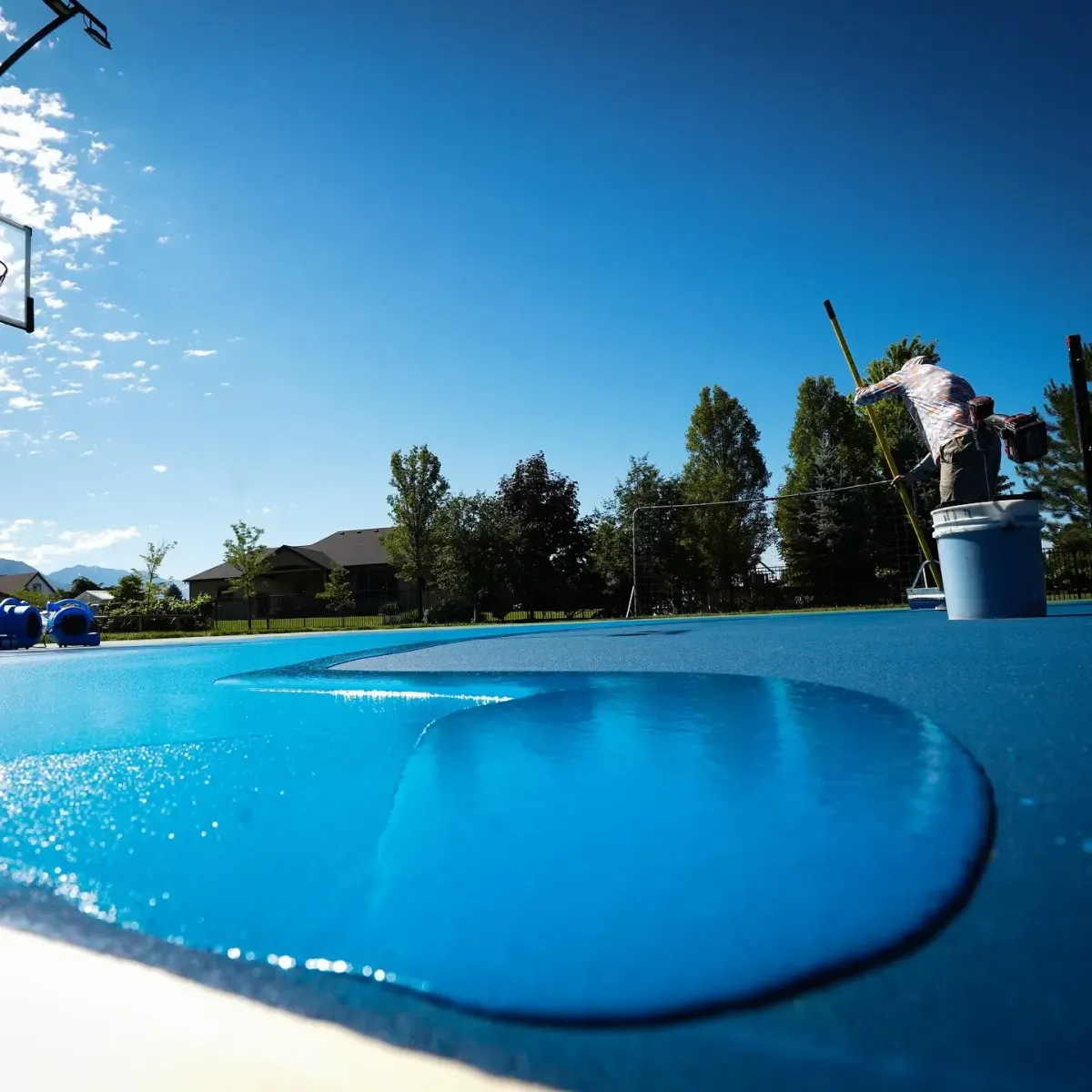 an employee of Ace Coatings Utah on duty for pickleball court builder in Utah