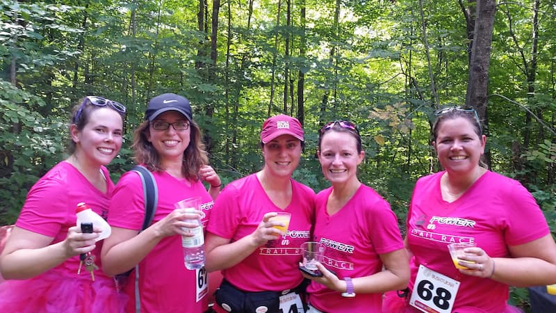 Women runners wearing pink shirts at Mad Trapper Power in Pink trail race, raising funds for local cancer support