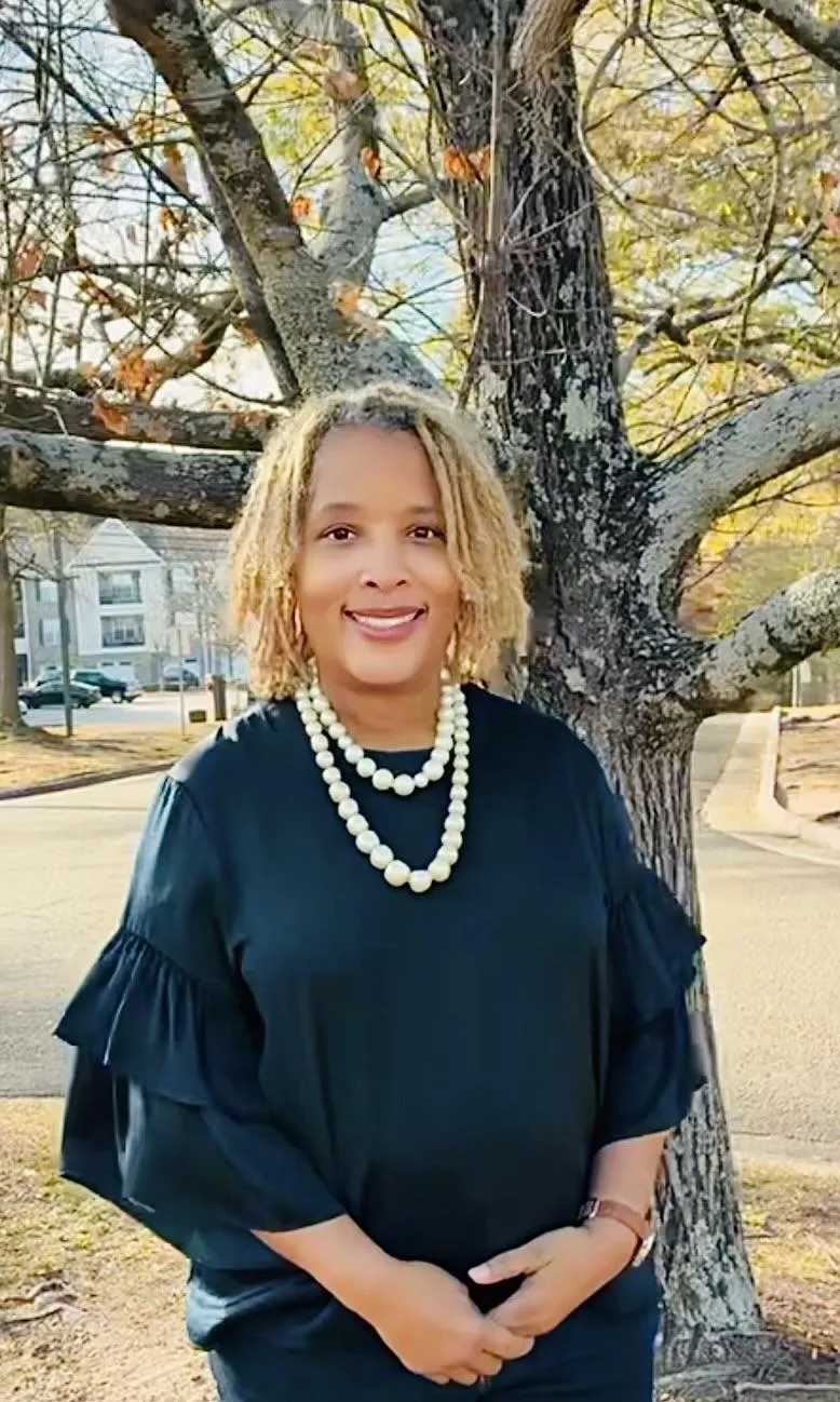 person wearing silver ring and white long sleeve shirt