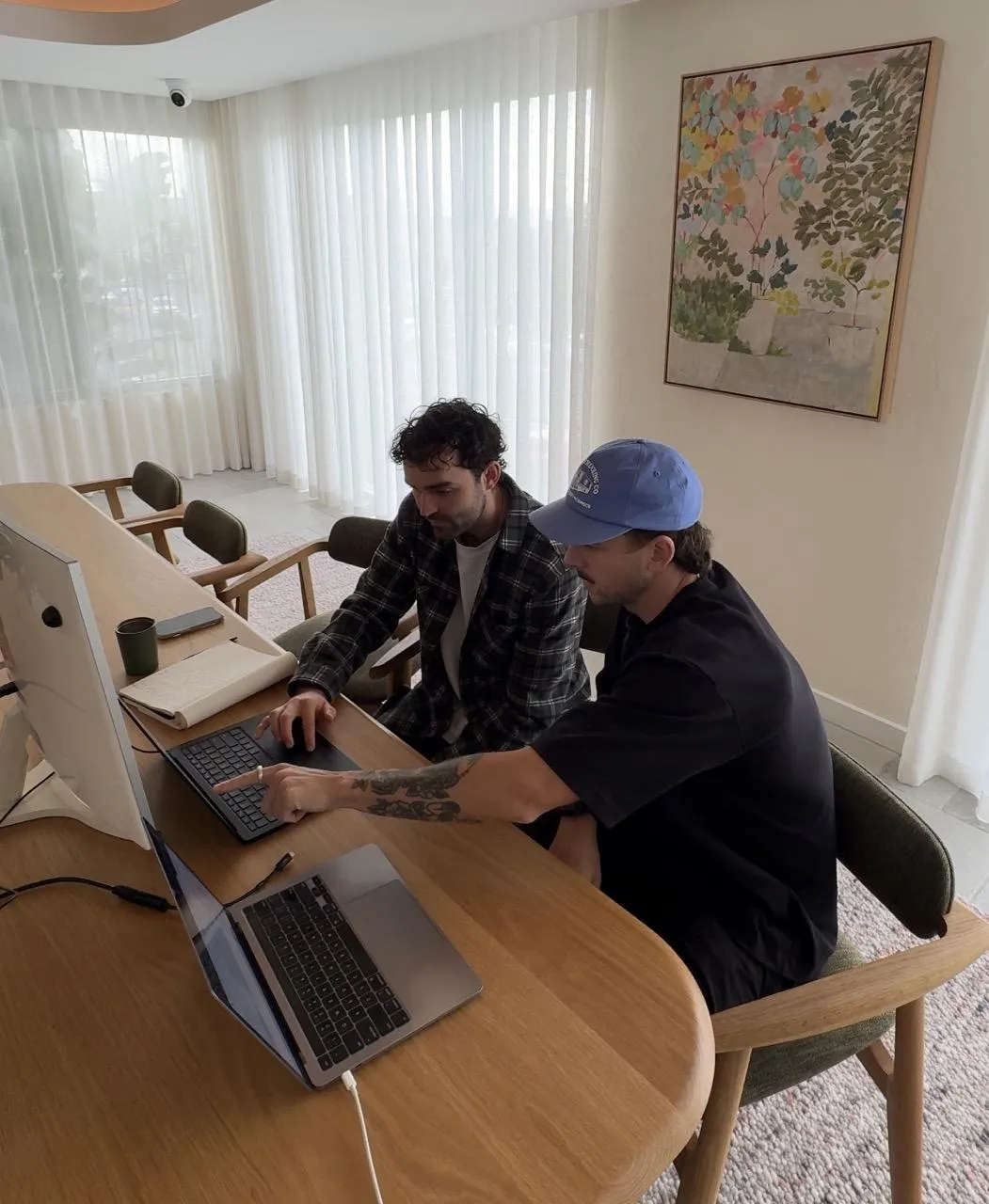 Building ads together on a laptop during a session