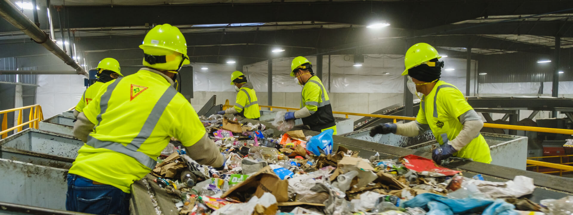 group of people in red and brown uniform playing ice hockey