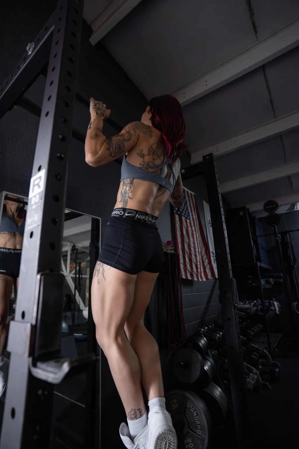 Two people doing yoga in a park.