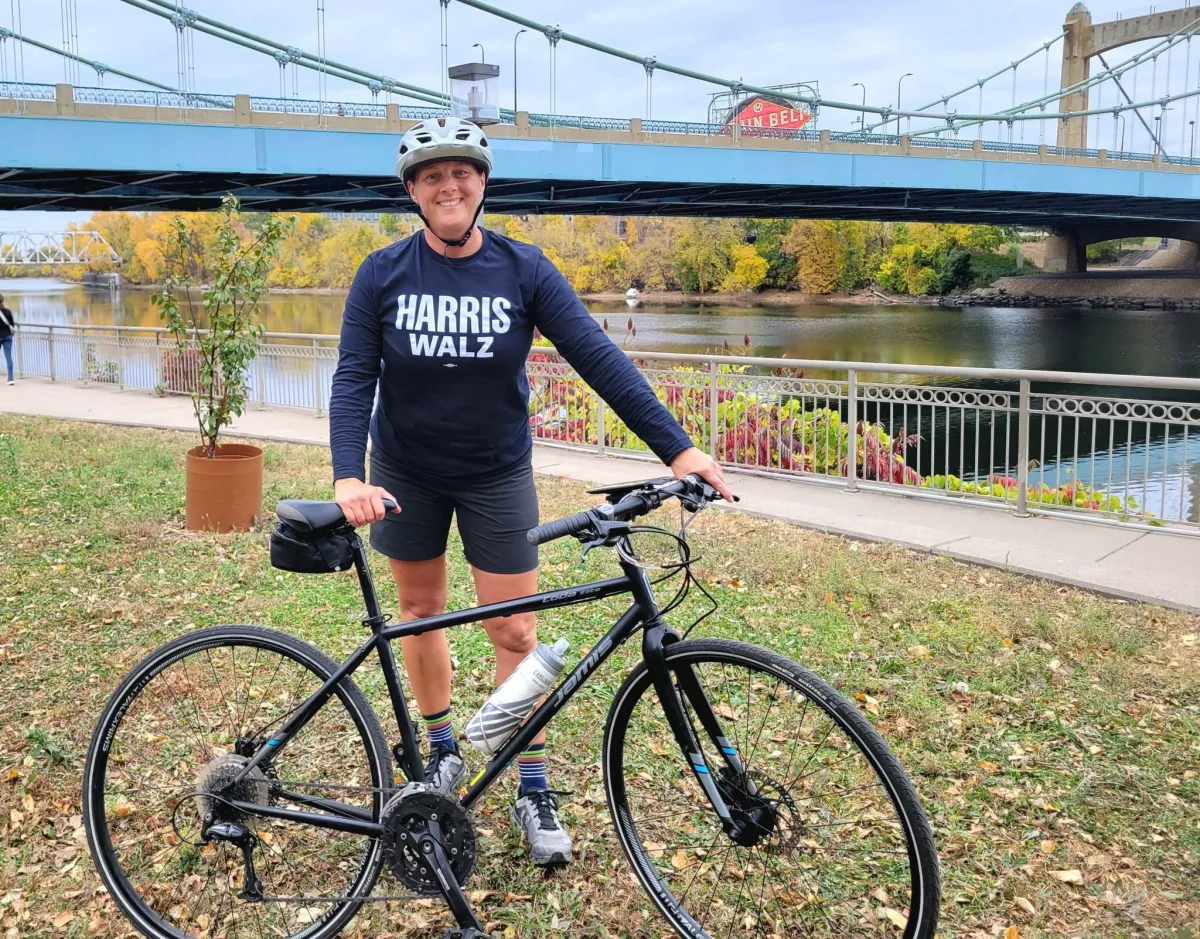 woman-bike-LGBTQ-real-estate-agent-Angie-Groettum-ReMax-Preferred-Minneapolis-MN