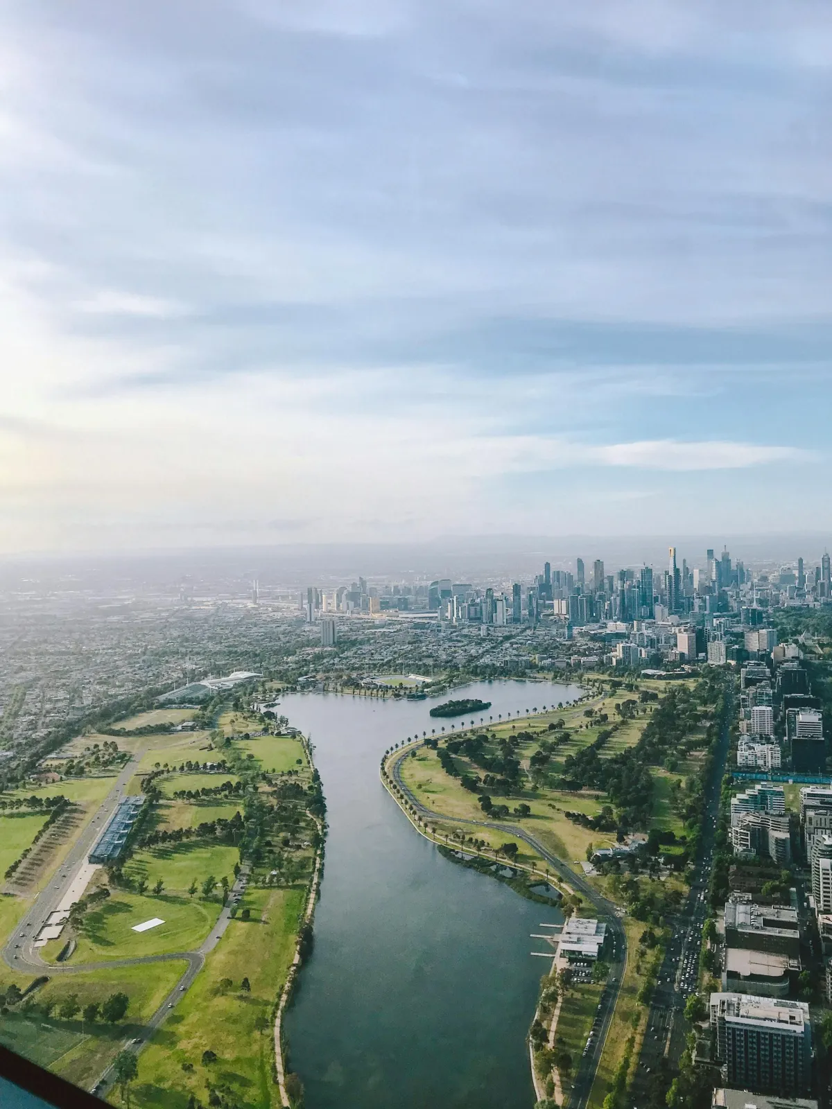 An aerial shot of Albert Park lake and Mebourne, one location Aus Biz Ai provides ai automation services for business