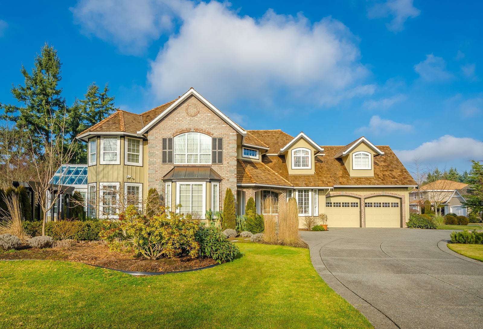 lighted house beside trees
