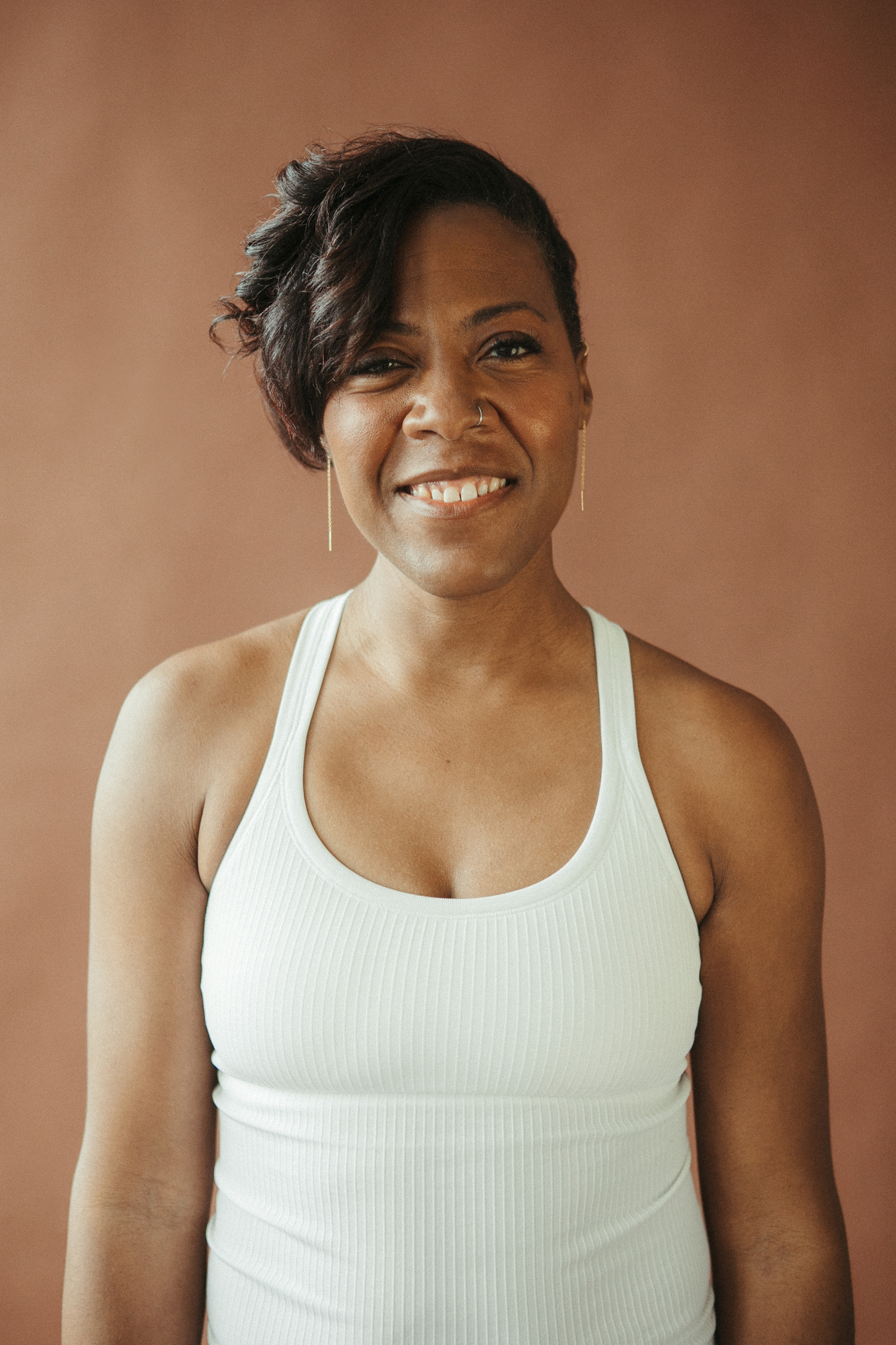 Ylonda Rosenthal-Green in a white tanktop 