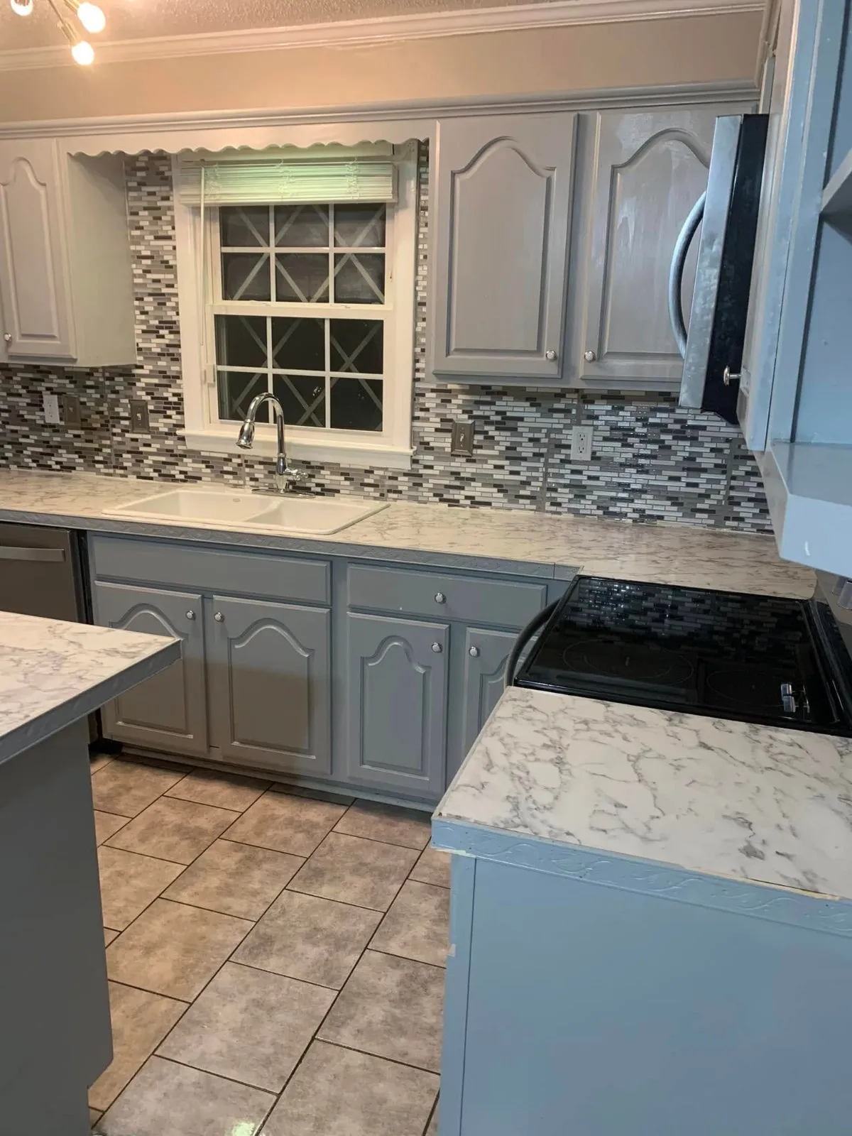 Kitchen with granite counters and mosaic backsplash cleaned by Pretty in Pink Cleaning Service in Wetumpka, AL