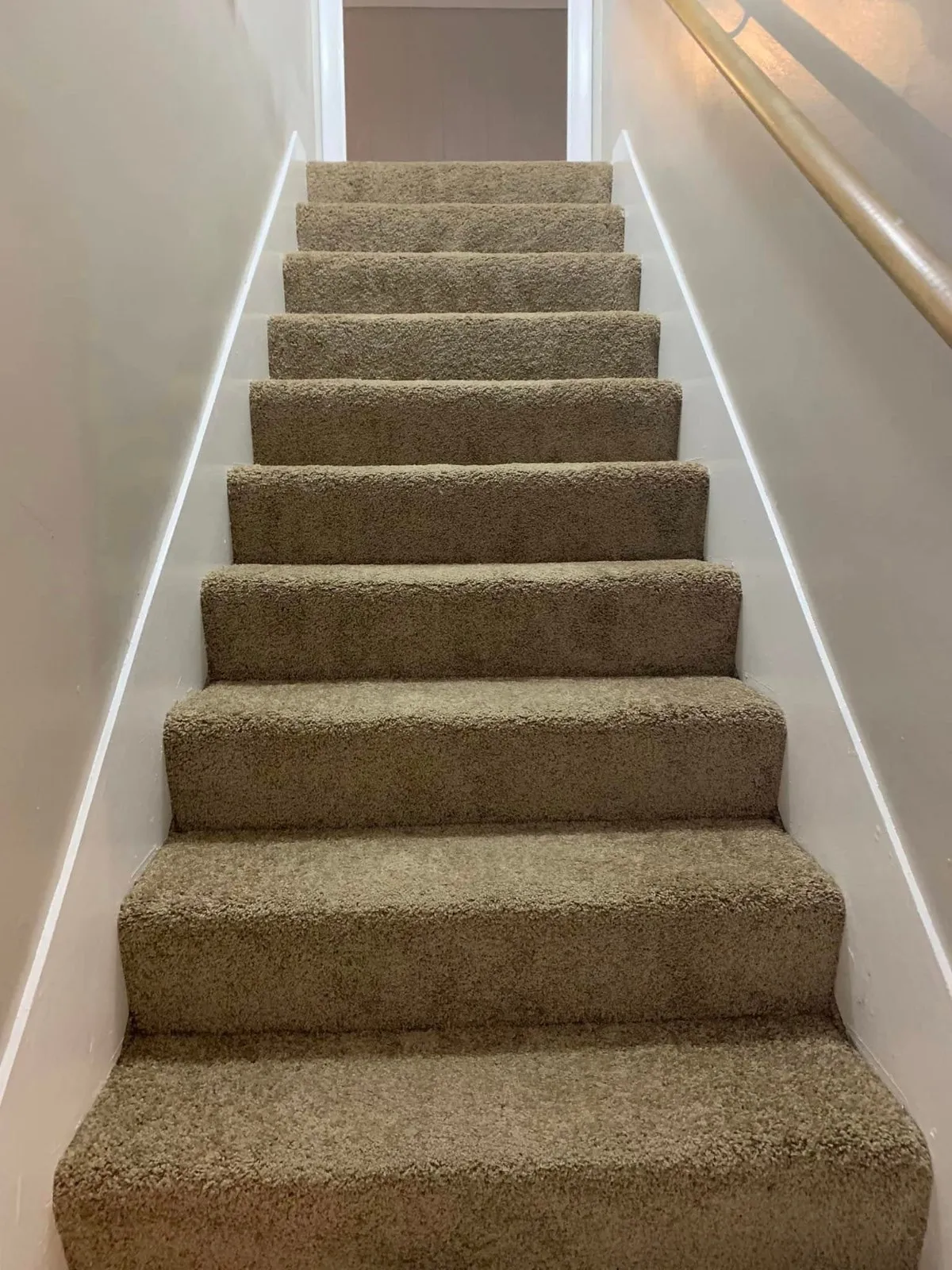 Vacuumed carpeted staircase cleaned by Pretty in Pink Cleaning Service in Wetumpka, AL