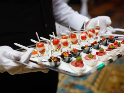 Fancy Fiesta butler-style staff serving appetizers at a formal event in Midland, TX