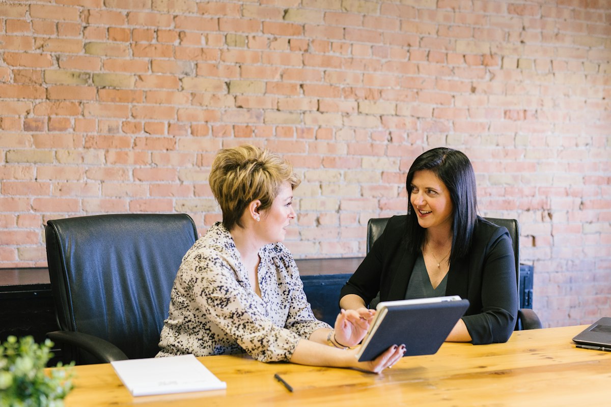 Tax preparer reviewing documents with a client