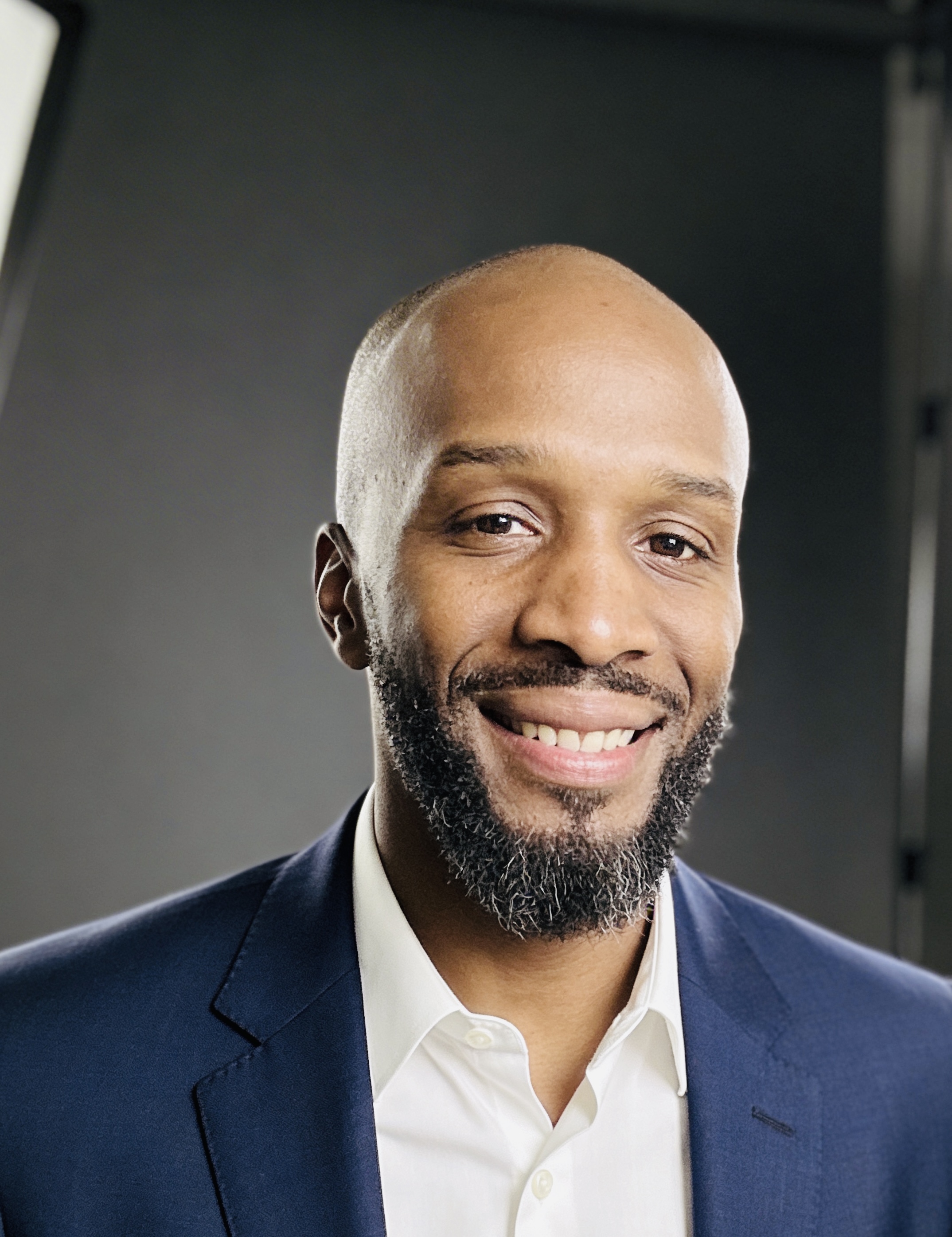 a kitchen with three stools and a center island