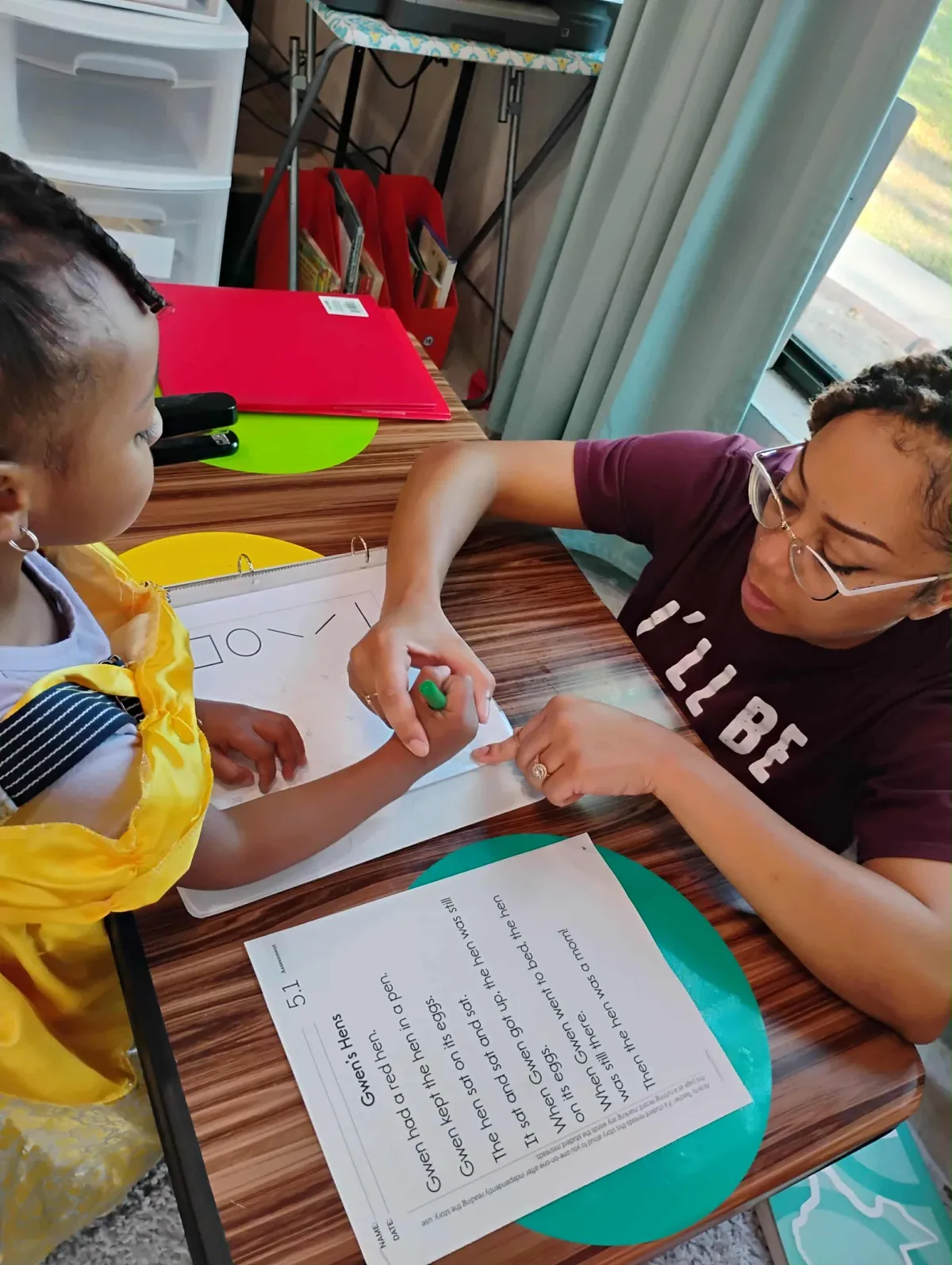 Girl stretches to the side while watching teacher on large screen TV