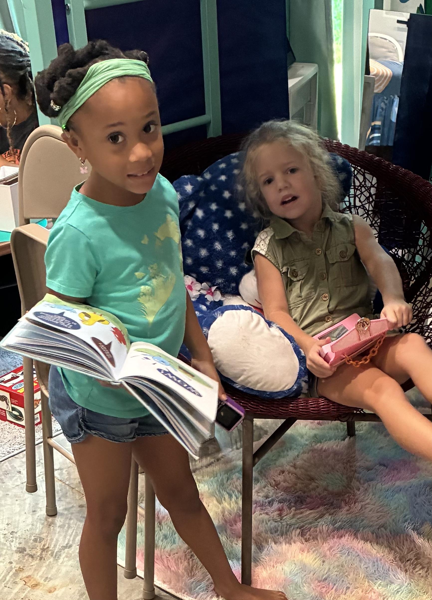 Boy picks paper out of different colored liquids